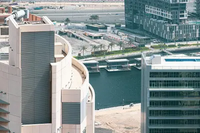 an aerial view of a city with a river and buildings at SmartStay at Burj Royale - Unique Downtown Dubai City Views - Brand New Luxury Apartments in Dubai