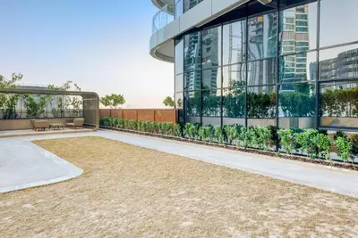 a rendering of a building with a gravel courtyard at RH- Elevated Living, Modern 1BR Oasis at RP Heights walk away to Dubai Mall in Dubai