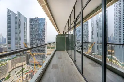 a balcony in a tall building with windows at RH - Burj Khalifa View, 01 BR Bliss at RP Heights, walk away to Dubai Mall in Dubai