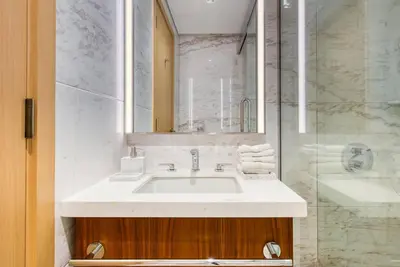 a bathroom with a sink and a shower at RH - Burj Khalifa View, 01 BR Bliss at RP Heights, walk away to Dubai Mall in Dubai
