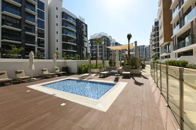 a swimming pool on a balcony of a building at Stylish and Modern Studio at Azizi Riviera - Dubai in Dubai