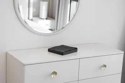 a white dresser with a mirror on top of it at Bright 2BR with Pool & Creek Views in Dubai