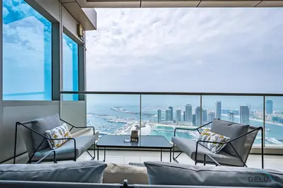 a living room with a view of the city at Luxury 3BR in Ocean Heights, Dubai Marina by Deluxe Holiday Homes in Dubai