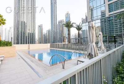 a swimming pool on a balcony with a city skyline at Forte Tower - Dubai Fountain View, Downtown Dubai in Dubai