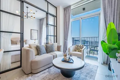 a living room with a couch and a table at Enchanting 1BR Apartment in Socio Tower, Dubai Hills Estate by Deluxe Holiday Homes in Dubai