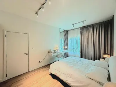 a bedroom with a bed and a desk and a window at quiet green 1 bedroom for your rest in Dubai