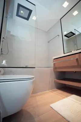 a bathroom with a toilet and a shower and a sink at High Floor, 1 Bedroom in Palace Residence in Dubai