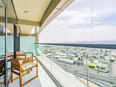 a room with a view of a city at Modern and Cozy Condo With Unobstructed City Views in Dubai