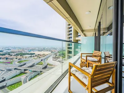 a balcony with a view of a city at Modern and Cozy Condo With Unobstructed City Views in Dubai