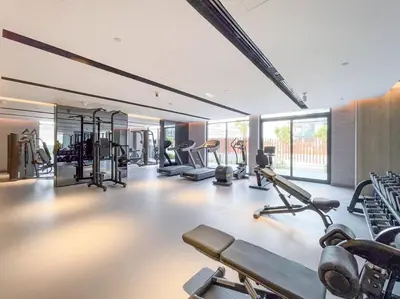 a gym with several treadmills and elliptical machines at New Listing * Pool & Marina Skyline View * TOP Amenities in Dubai