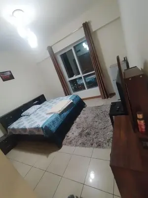 a bedroom with a bed and a large window at luxury master room available in sulafa tower marina in Dubai