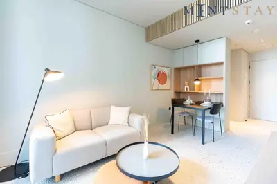 a living room with a couch and a table at Upside Living, Business Bay Dubai - Mint Stay in Dubai