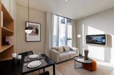 a living room with a couch and a table at Upside Living, Burj Khalifa View, Business Bay - Mint Stay in Dubai