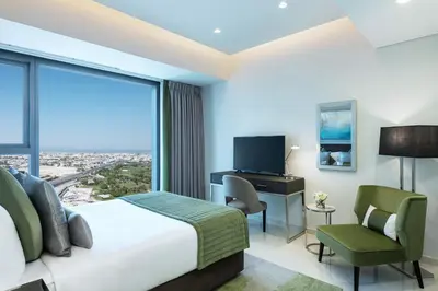 a hotel room with a bed and a large window at Aykon City Staycae Holiday Homes, Business Bay, Sheikh Zayed Road in Dubai