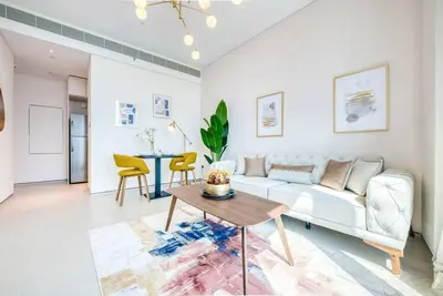 a living room with a couch and a table at 1BR Apartment at The Address JBR - Residential in Dubai