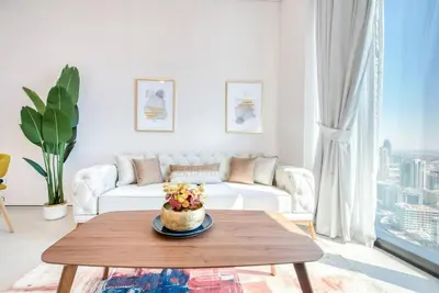 a living room with a white couch and a table at 1BR Apartment at The Address JBR - Residential in Dubai