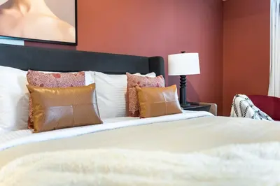 a bedroom with a large bed with pillows at The Smart Concierge - Elite residence in Dubai