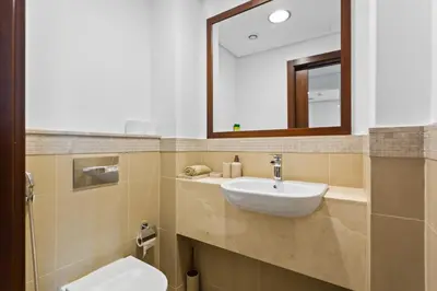 a bathroom with a sink and a mirror at Khalifa Views & Direct Mall Access in Burj Vista in Dubai