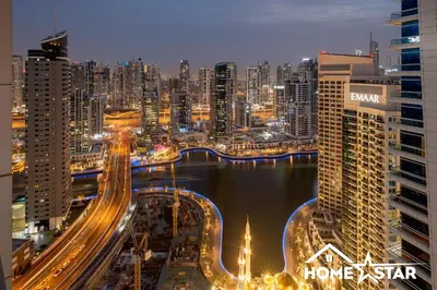 a view of a city at night with traffic at Marina & Beach Views, Pool, Art Haven! Near Cafes in Dubai