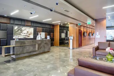 a lobby of a hotel with a reception desk at Marina & Beach Views, Pool, Art Haven! Near Cafes in Dubai