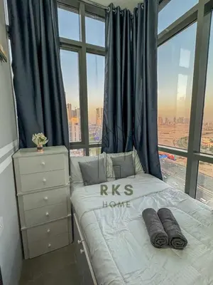 a bedroom with a king bed and a large window at Hostel with Private Room near Downtown Business Bay in Dubai