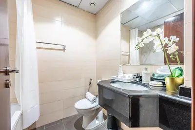 a bathroom with a sink and a toilet at Elite Vista Studio Elite 10 Sports Residences in Dubai