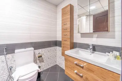 a bathroom with a toilet and a sink at Studio Apartment in Resotz Residence Arjan - Close to Miracle Garden in Dubai