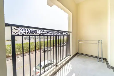 a balcony with a view of a parking lot at Studio Apartment in Resotz Residence Arjan - Close to Miracle Garden in Dubai