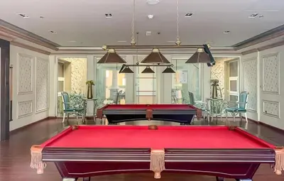 a pool room with a pool table in a room at Studio Apartment in Resotz Residence Arjan - Close to Miracle Garden in Dubai