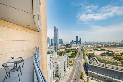 a balcony with a view of a city at Jubilant Studio at Sky Gardens, DIFC by Deluxe Holiday Homes in Dubai