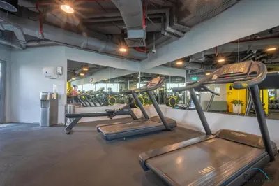 a gym with two exercise bikes in a room at Jubilant Studio at Sky Gardens, DIFC by Deluxe Holiday Homes in Dubai