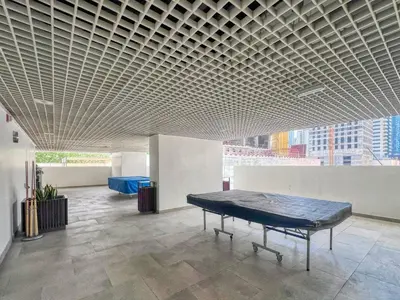 a room with a table in the middle of a building at GuestReady - Luxury haven at Marina Arcade in Dubai