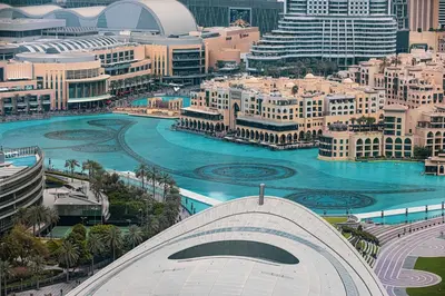 a view of a city with a river and buildings at Luxury 4BR Burj Khalifa & Fountain Views in Dubai
