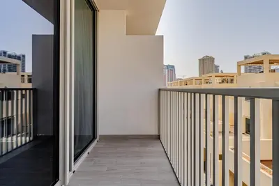 a balcony with a view of the city at Modern and Cozy Studio in JVC I Luma Building in Dubai