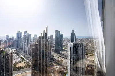 an aerial view of a city with tall buildings at Opera Grand by Emaar LUXURY 1 BR Apartment in Downtown Dubai sea and city view in Dubai