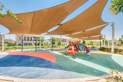 a playground with a slide in a park at Keysplease Beautiful 3 B/R Villa With Garden, Serena in Dubai