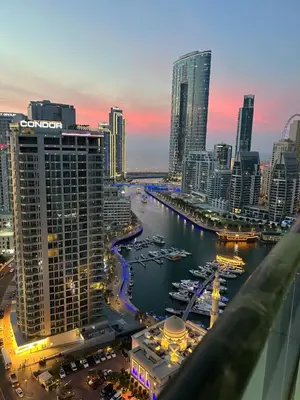 a view of a city with boats in the water at Modern 1BR Apartment in Dubai Marina with sea view in Dubai