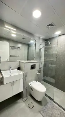 a bathroom with a toilet and a sink and a shower at Modern 1BR Apartment in Dubai Marina with sea view in Dubai