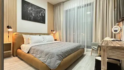 a bedroom with a bed and a large window at Modern 1BR Apartment in Dubai Marina with sea view in Dubai