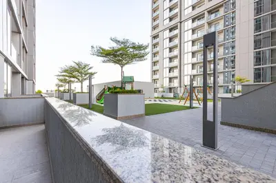 a walkway in a city with tall buildings at Sobha Creek Vistas Cozy 1BDR with balcony in Dubai