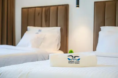 a hotel room with a box on a bed at Super Luxurious! New 2BR in Jumeirah Garden City in Dubai