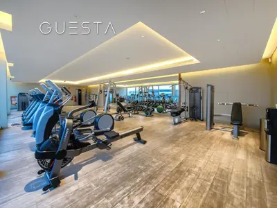a gym with treadmills and elliptical machines at Sobha Creek Vistas, Sobha Hartland, MBR City, Dubai in Dubai