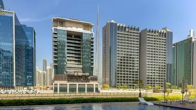 a view of a city skyline with tall buildings at 1BR near Dubai Mall 10 Min walking distance in Dubai
