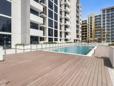 a swimming pool in the middle of a building at StoneTree - Azizi Riviera 36 Studio - Brand new in Dubai