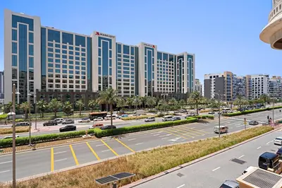 a view of a city with tall buildings and a street at Stonetree - Golden Mile 4 - Beach Access in Dubai