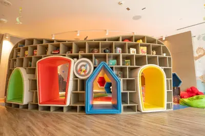 a playroom with a large play room with colorful shelves at Highest infinity Pool in Downtown Dubai in Dubai