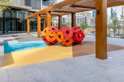 a group of colorful objects sitting on a sidewalk at Luxury of 1 minute walk to Burj Khalifa & D/Opera in Dubai