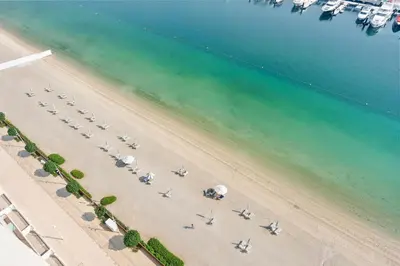 an overhead view of a beach with airplanes on it at Silkhaus Partial Marina View 1BDR in Marina Vista in Dubai