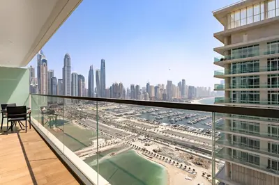 a view of the city from the balcony of a skyscraper at Silkhaus Partial Marina View 1BDR in Marina Vista in Dubai