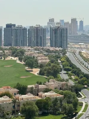 an aerial view of a city with tall buildings at Stay in brand new Luxury Sport City apartment 15 in Dubai